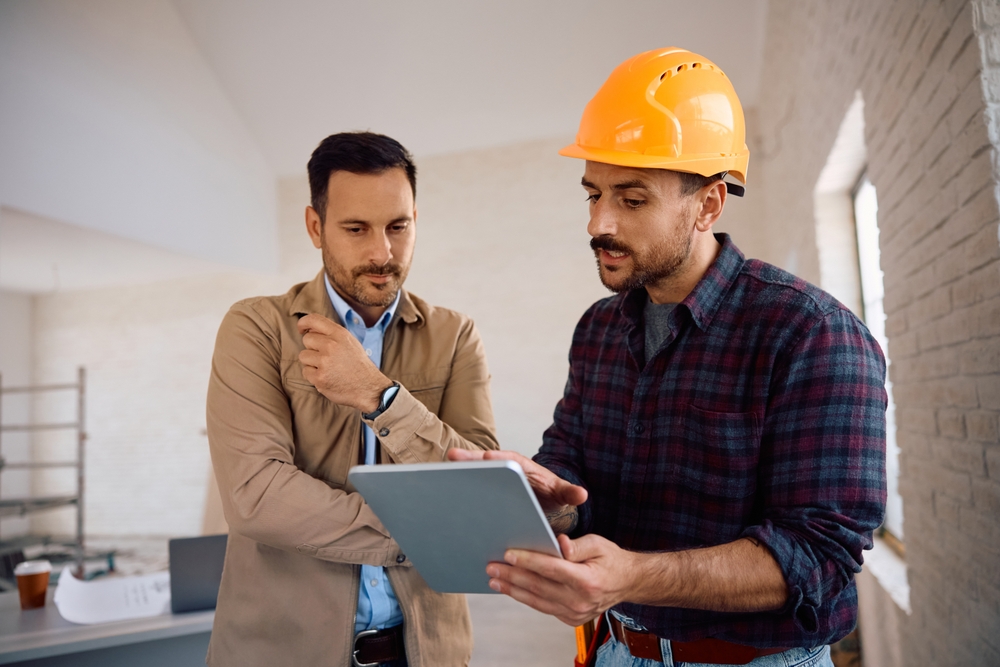 contractor with tablet crm software and customer