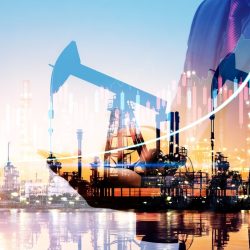 Businessman using digital tablet. Business global internet connection application technology digital marketing, Crude Oil pump oil rig energy industrial machine background. Crude oil increase price.